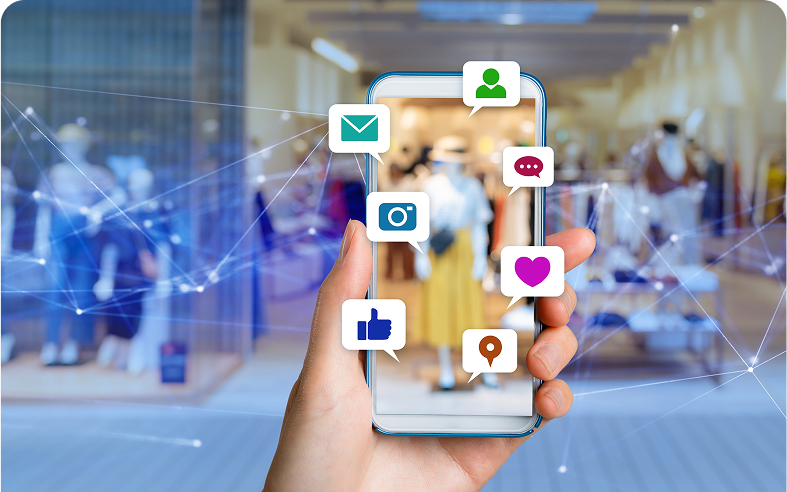 Hand holding smartphone with social media icons